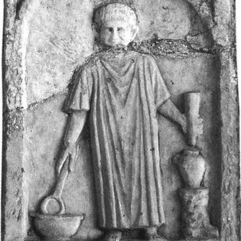 La stèle de Cherchel montre l'oliarius qui puise l'huile avec sa cupa olearia